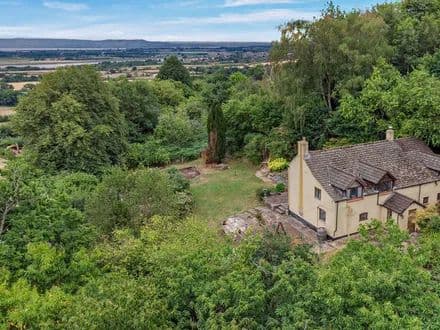 A detached cottage, occupying an elevated position looking over the Severn Valley